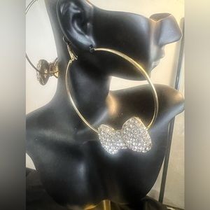 Oversized gold tone Hoop Earrings with rhinestone bow charm dangle, latch clasp